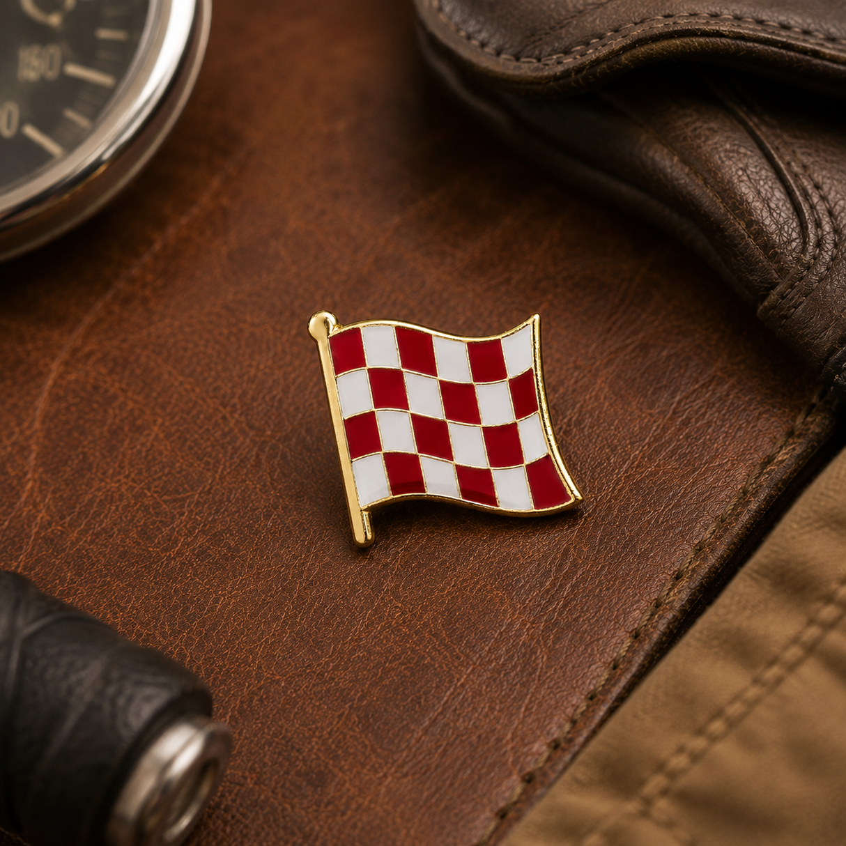 Stage One Pin in a vintage motorcycle-inspired leather flat lay