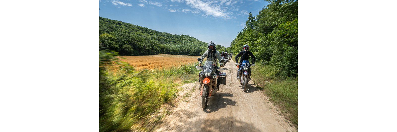 KTM Adventure riders on a gravel trail during the Europe Adventure Rally