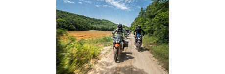 KTM Adventure riders on a gravel trail during the Europe Adventure Rally