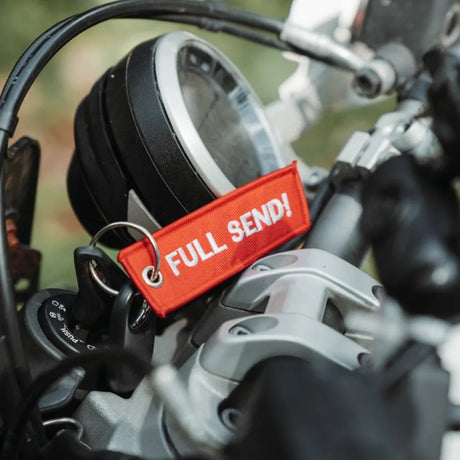 Rottweiler Motors Full Send woven keychain on motorcycle