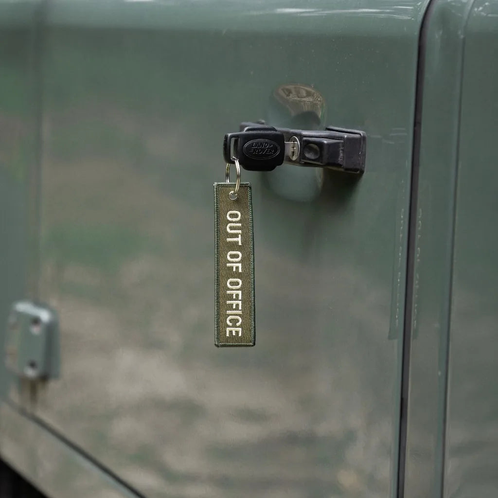 Rottweiler Motors Out of Office woven keychain on Land Rover