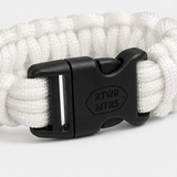 Close-up of the laser-engraved RTWR MTRS buckle on the 300 LB paracord bracelet