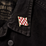 Stage One Pin attached to a black denim jacket