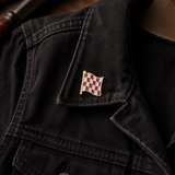Stage One Pin on a black jacket collar